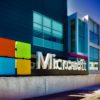 Mountain View, USA - March 4, 2015: Microsoft sign at the entrance of their Silicon Valley campus in Mountain View, California. One of the main buildings can be seen in the background. Oblique view.